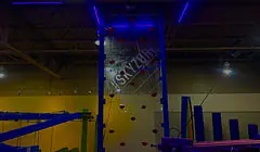 Glow-in-the-dark climbing wall at Astro Fun World