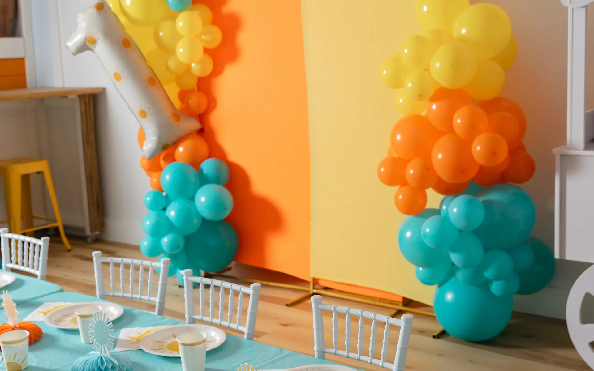 Styled birthday party setup with balloons at Happy Days Play Cafe
