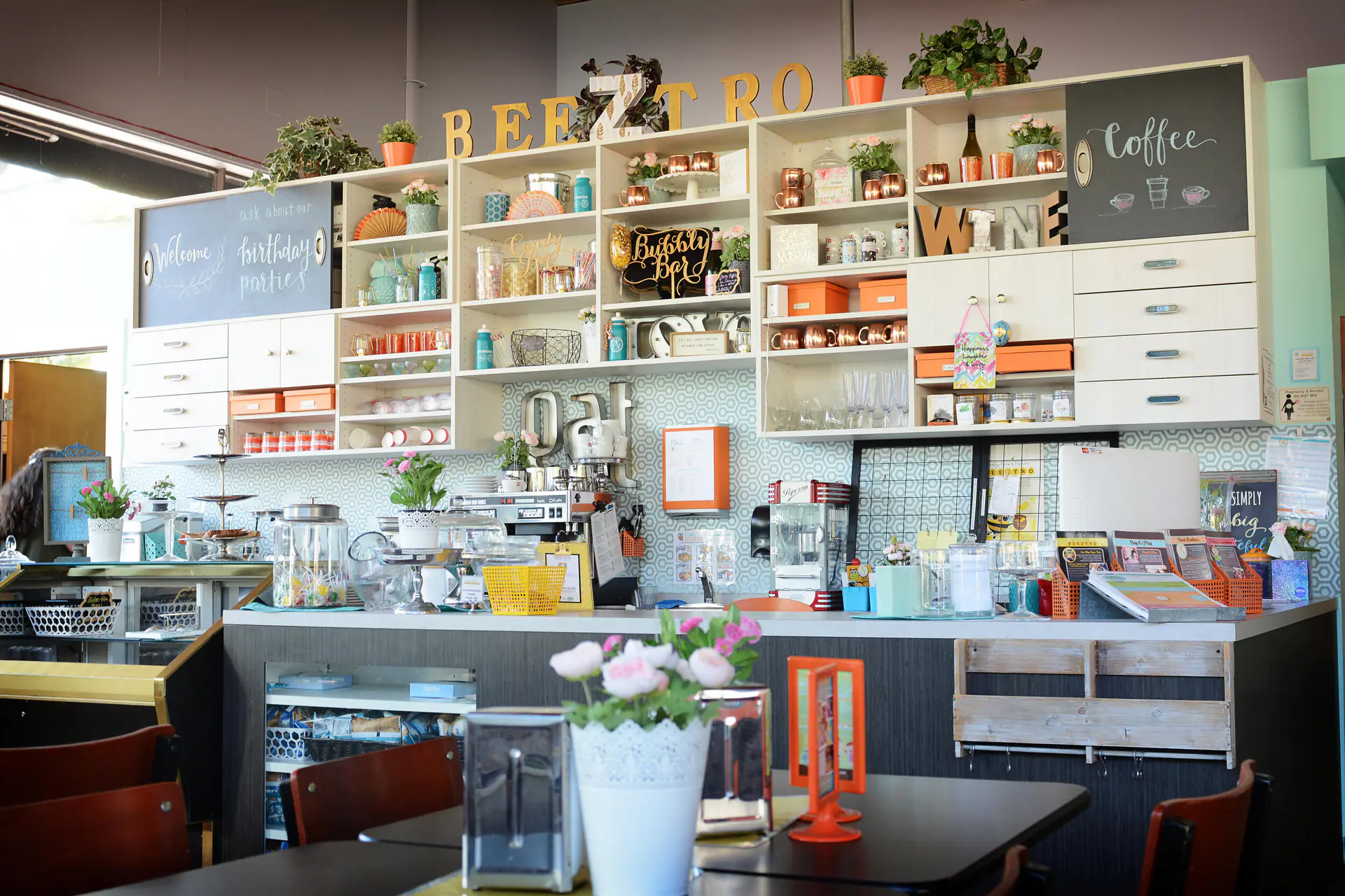 Cafe seating and food counter area at Play Boutique
