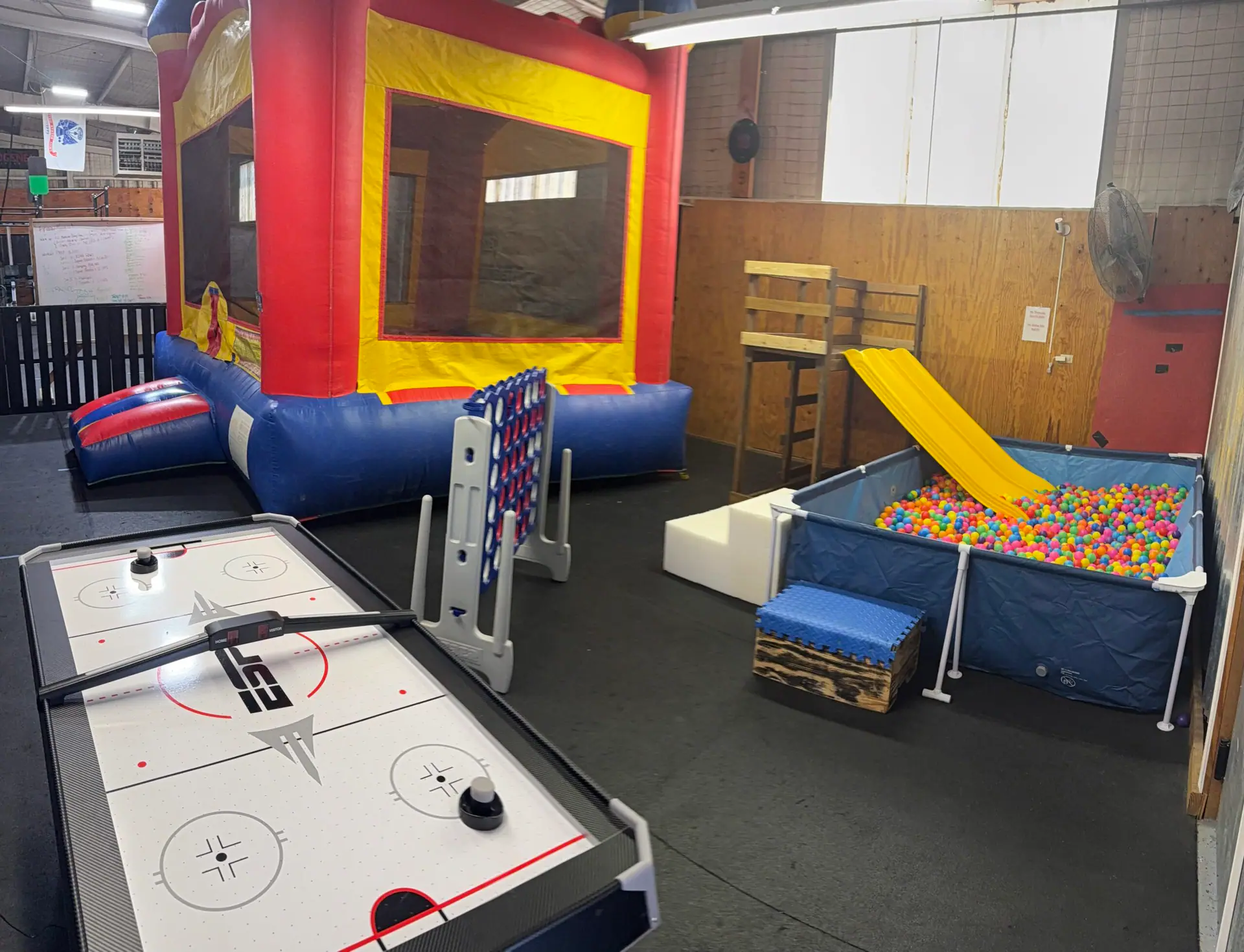 Bounce house, ball pit slide, and play area inside Garden City Fun Zone