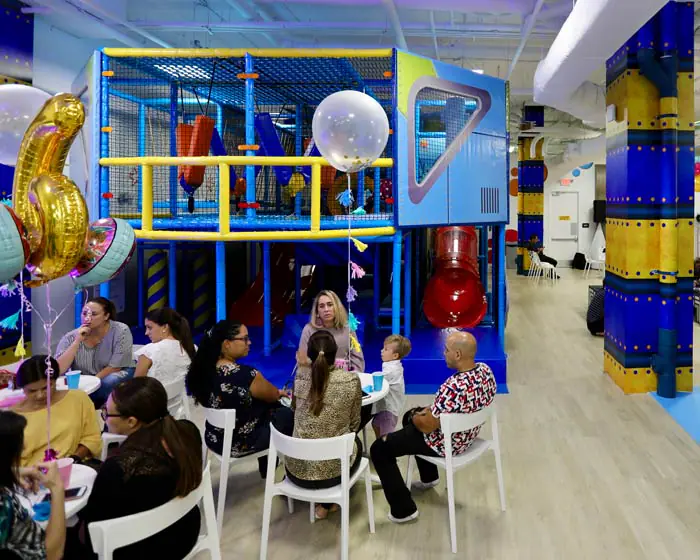Party seating and indoor play area at Marina Kids.