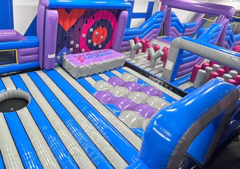 Inflatable obstacle area inside MACH1 Adventure Park.