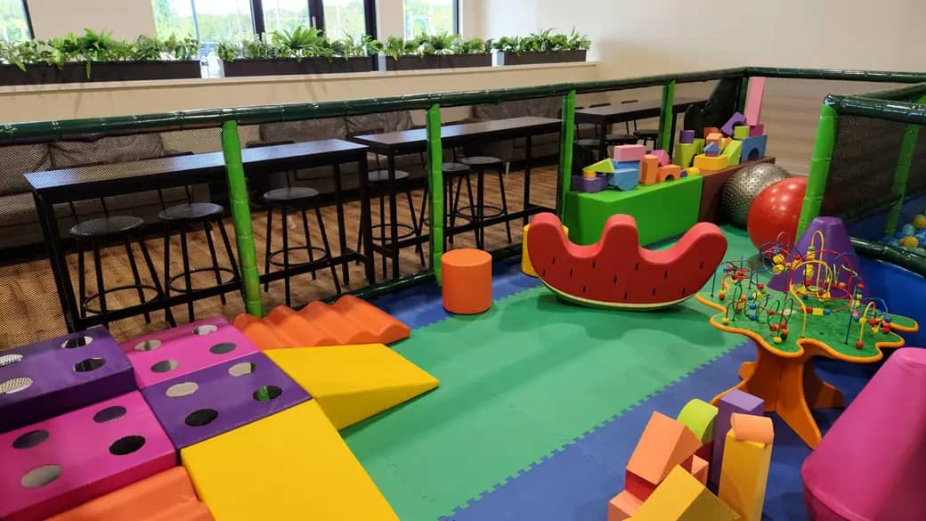 Soft-play toddler area with climbers and activity toys at Play Jungle Indoor Adventure