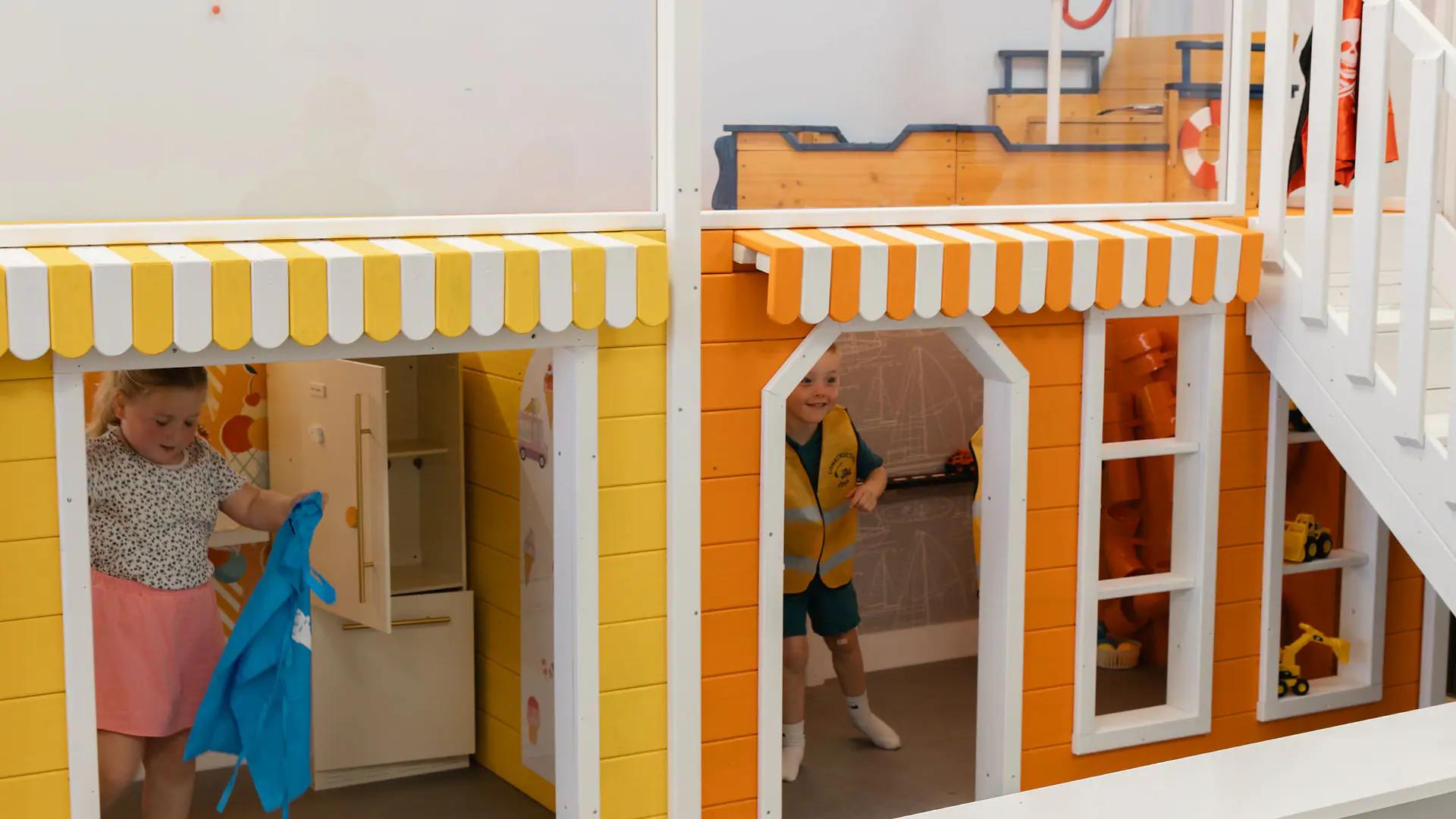 Surf-inspired two-story playhouses at Happy Days Play Cafe