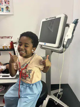 Child playing doctor inside Imagining With Me