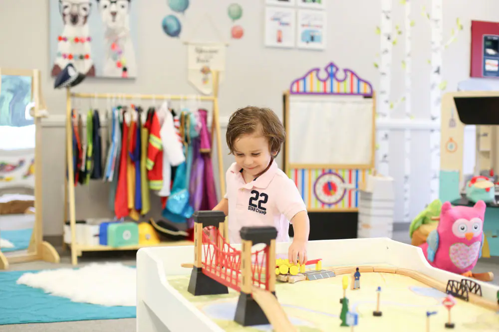 Young children playing in the bright imaginative-play studio at Play Time RI.