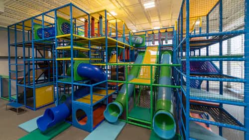Large indoor climbing structure and slides at The Park at Grace in Goshen.