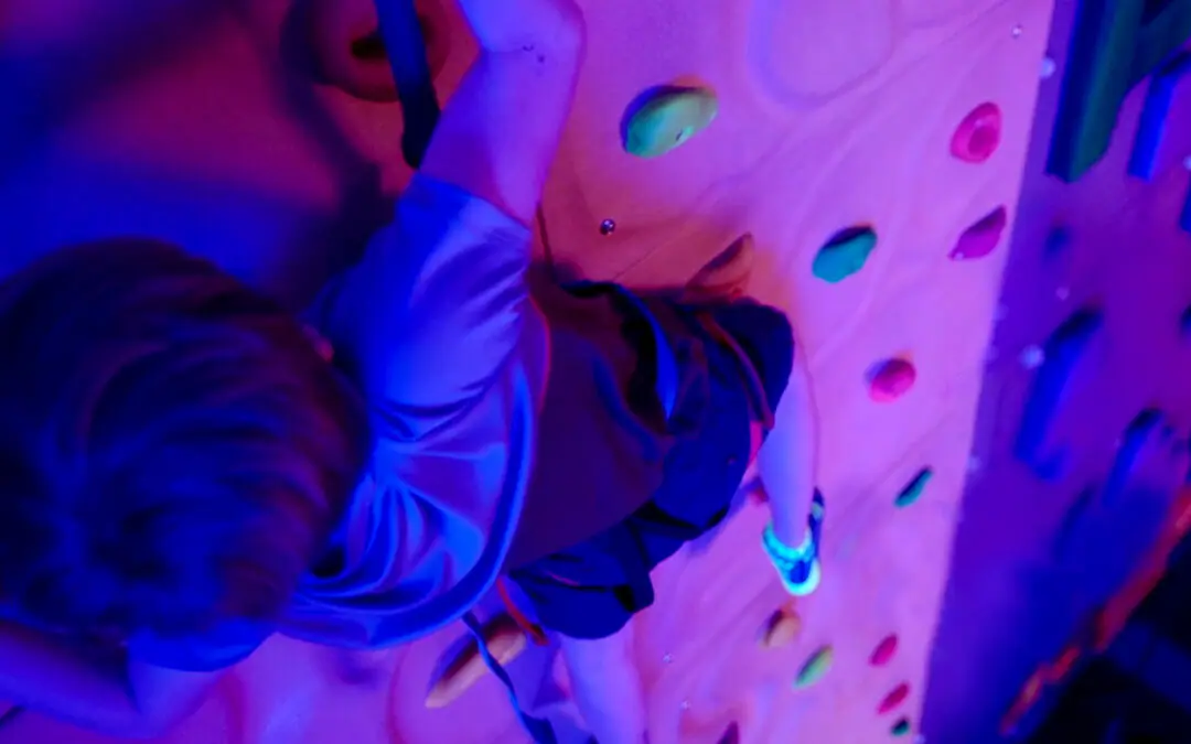 Children climbing colorful walls at Urban Air Adventure Park in Reno.