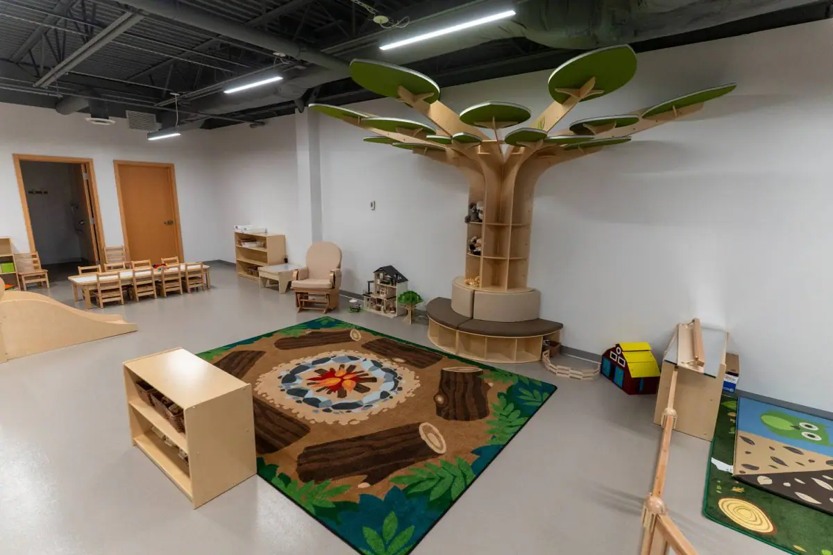 Pretend-play stations and seating inside LilyPad Café & Playcenter.
