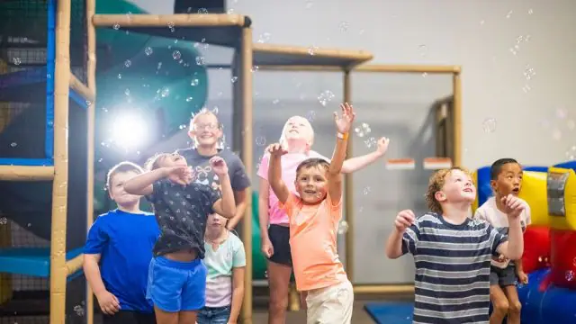 Children playing together in the main indoor play area at The Playground for Kids.