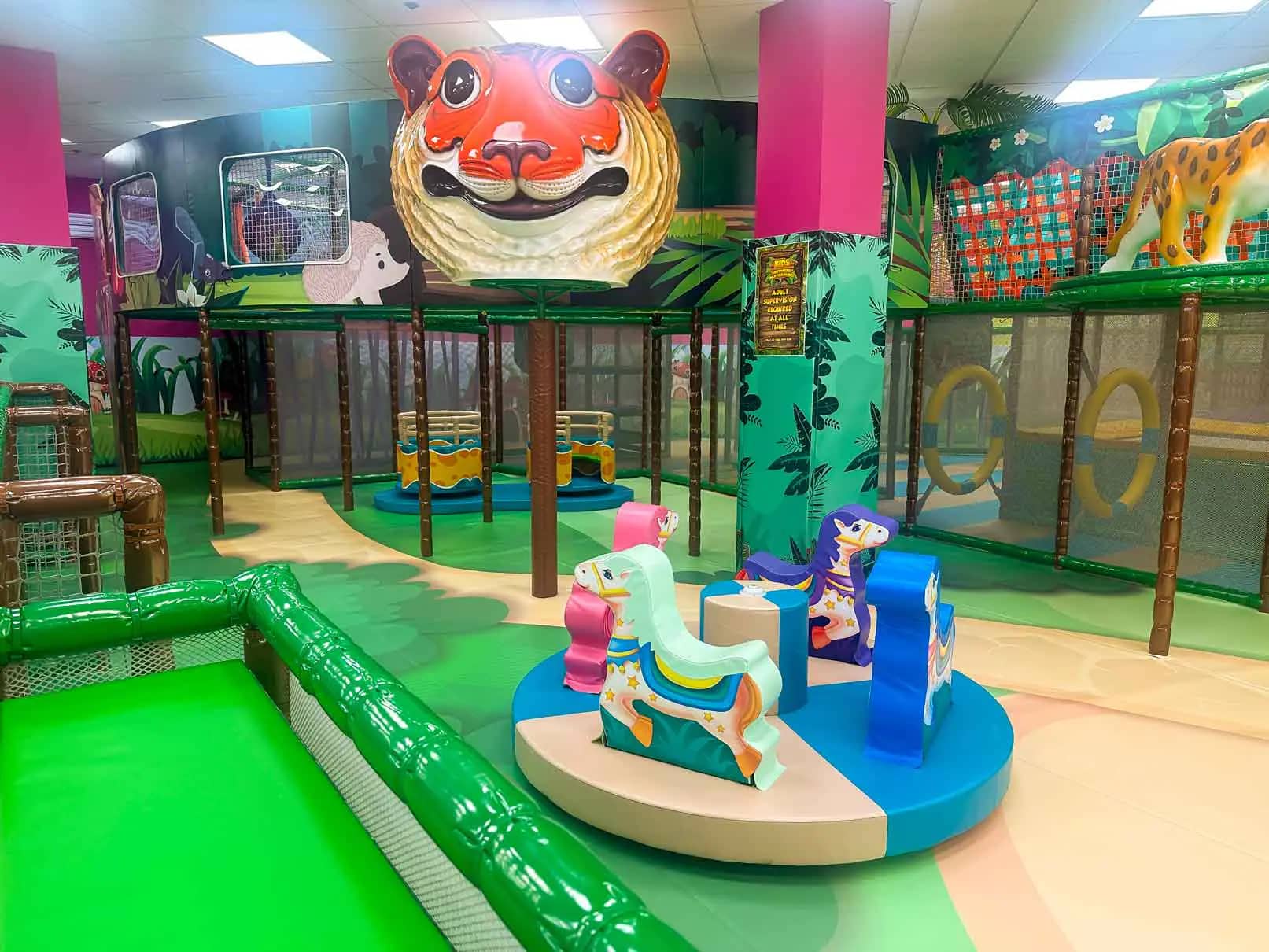 Indoor play features and seating at Kids Ultimate Playground Nashua.