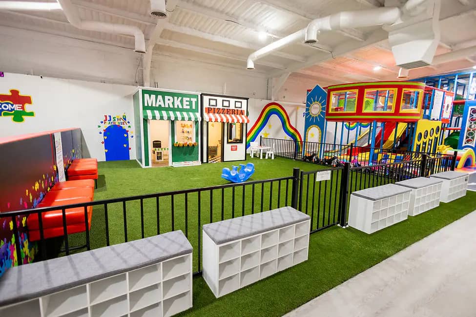 Indoor play structure and seating area at JJ's Playhouse in Snyder.