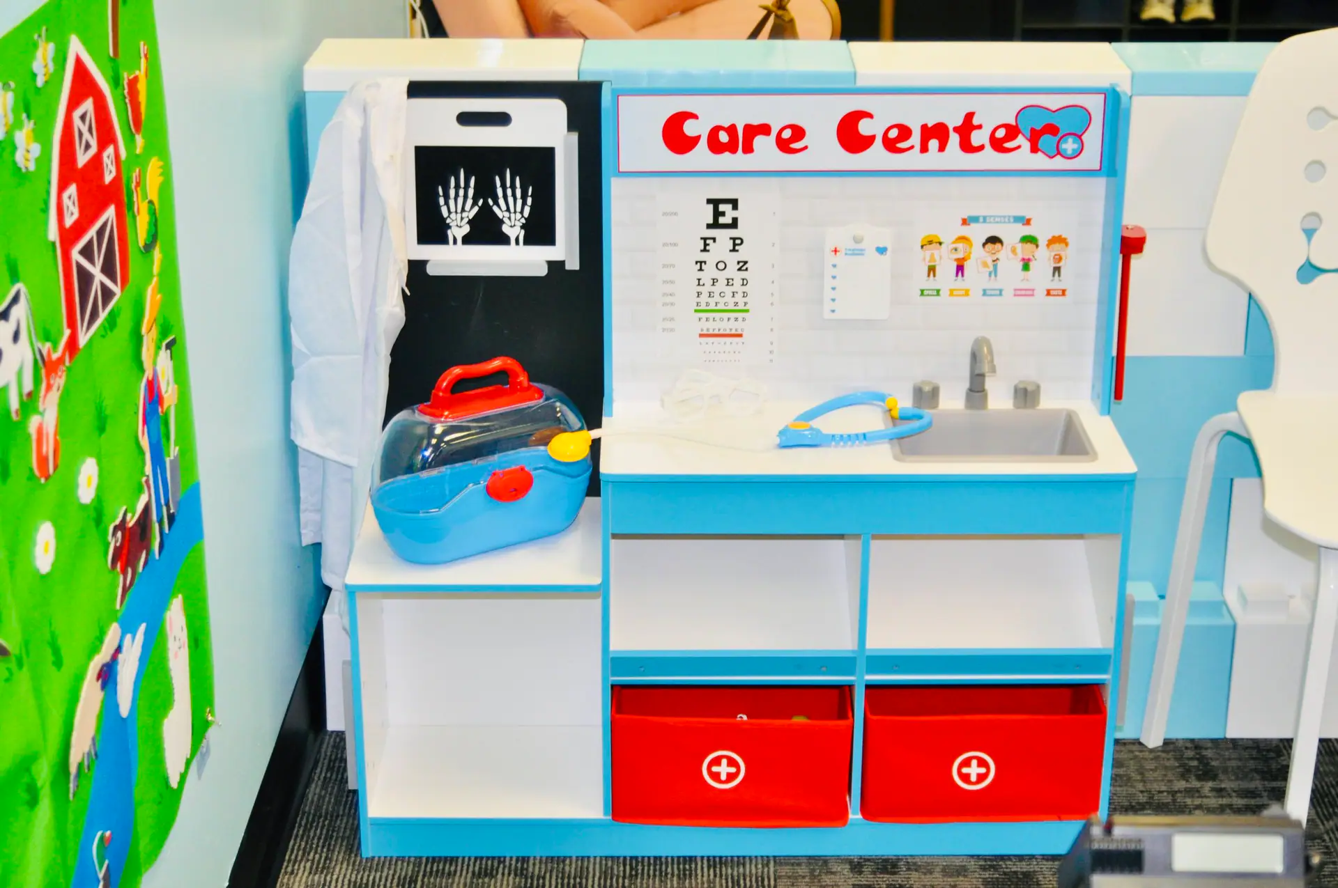 Doll and baby-care themed play area at The Beach House Play Center.