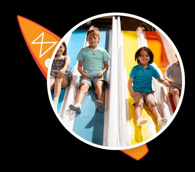 Kids playing on indoor Bounce Beach features at Malibu Jack's.