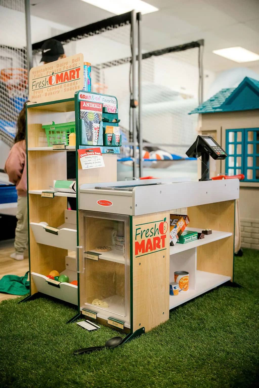 Pretend-play and indoor activity area at The Lemon Lounge.