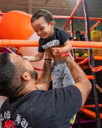 Parent and child inside the play structure at Rush Fun Park Peoria