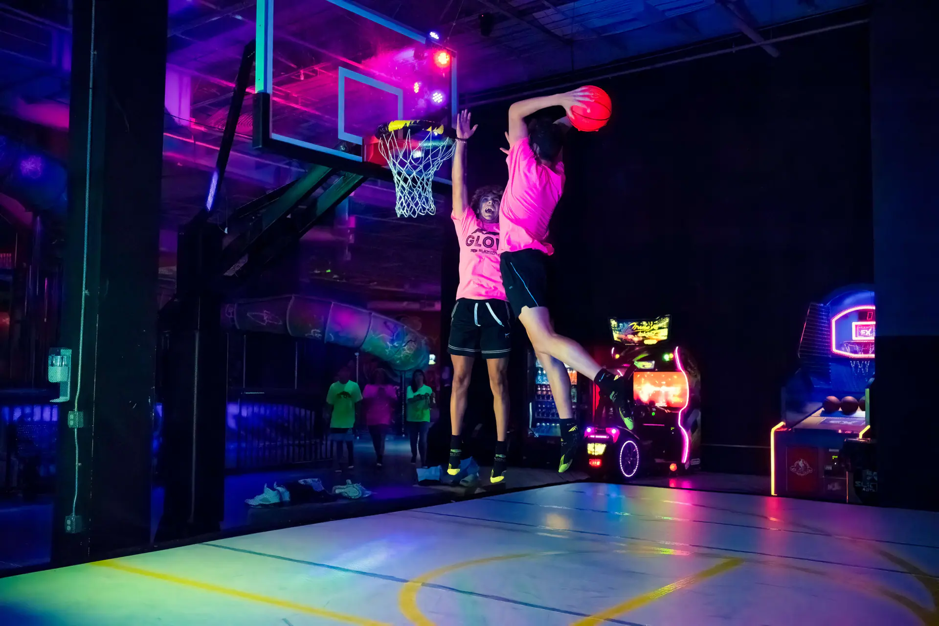 Glow lighting and slide attractions during a special event at Slick City.