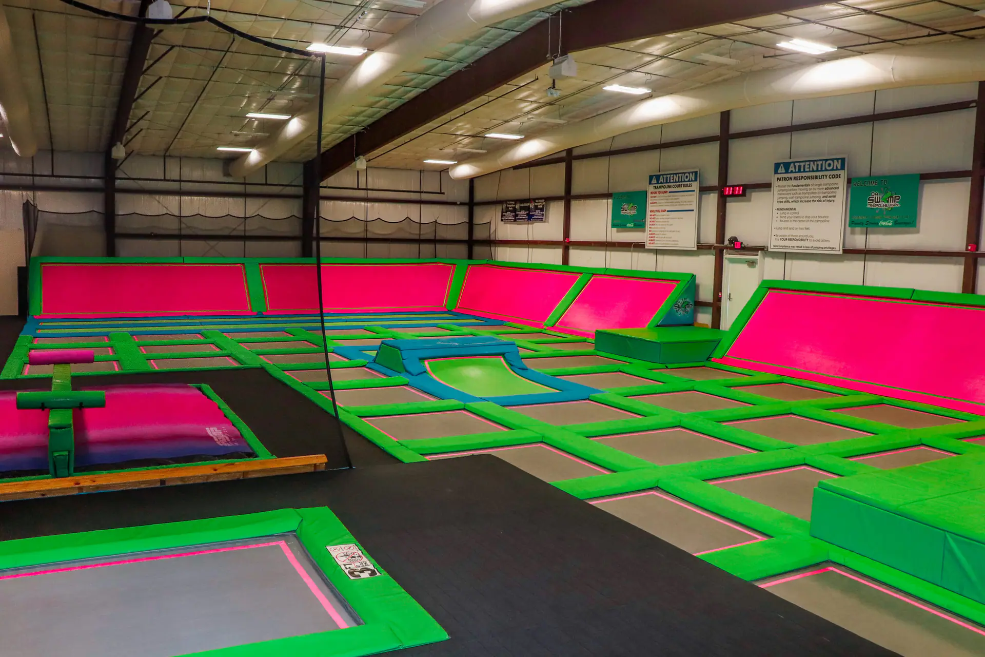 Another wide interior view of Da Swamp's main trampoline area.