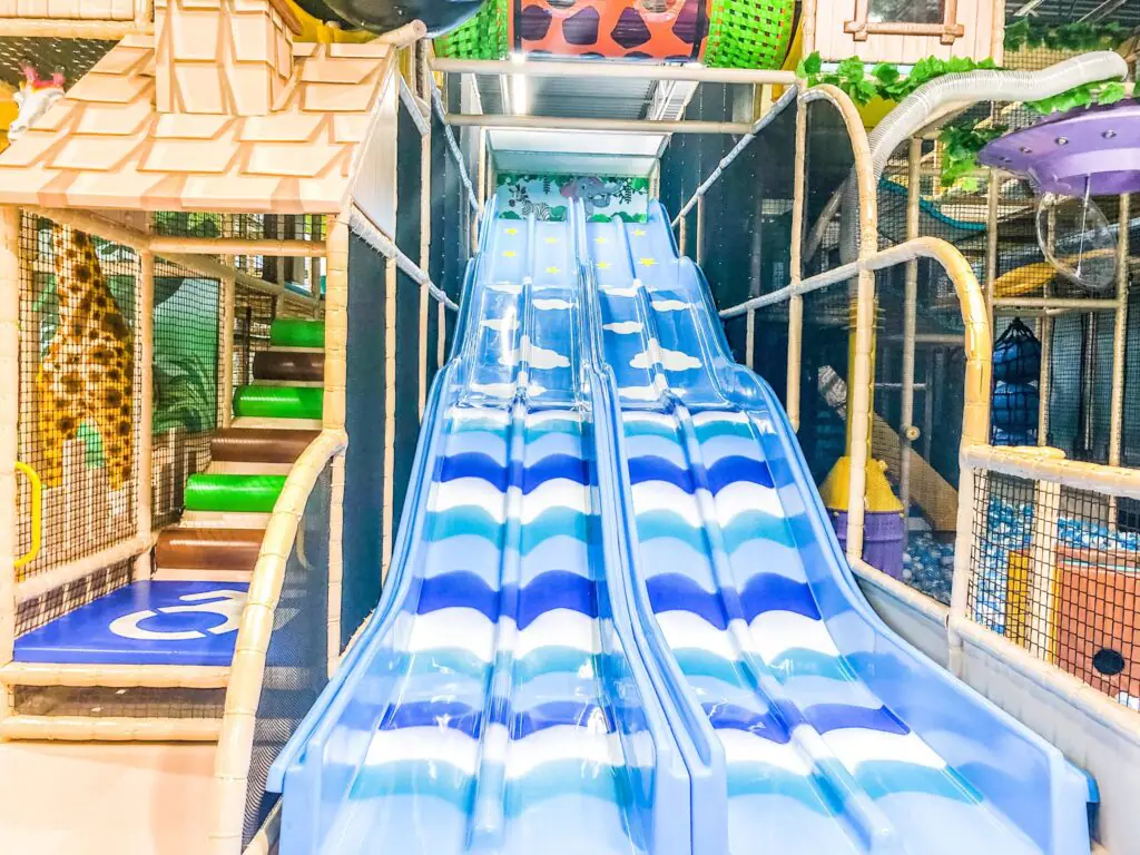 A wide interior view of Me Land - Frederick's play structure and play floor.