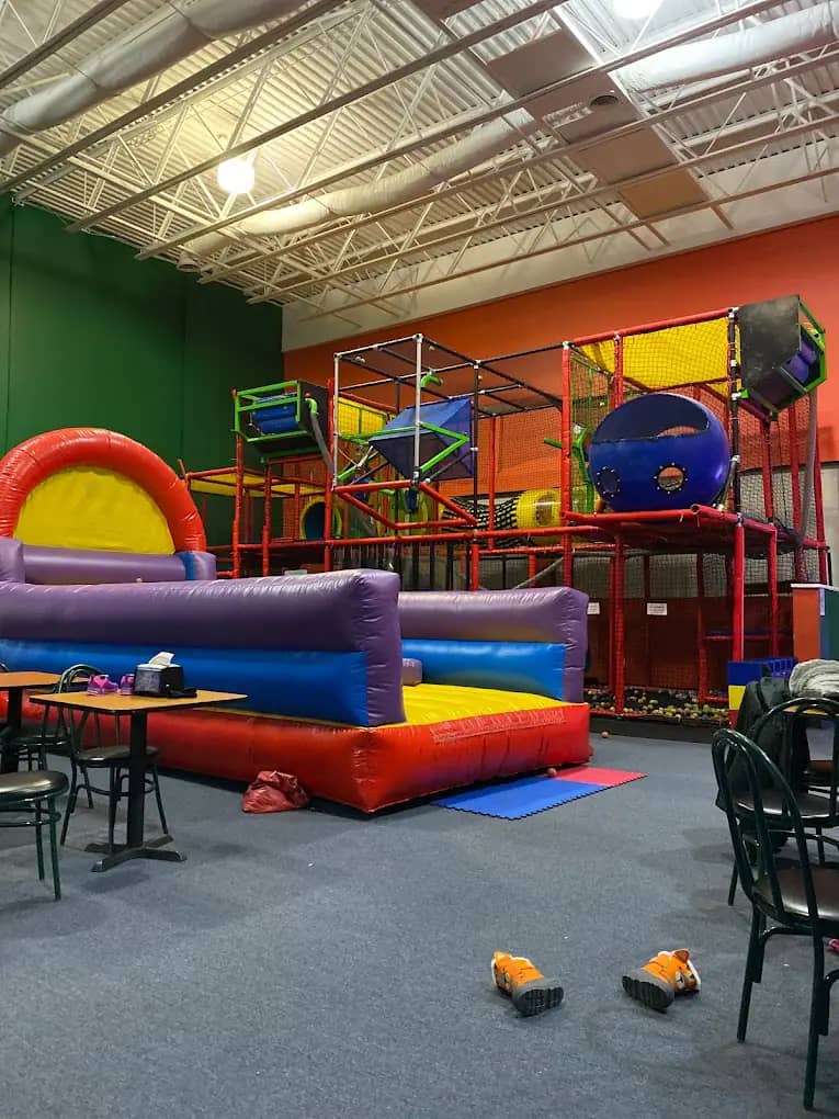 Indoor play structure and inflatable area at Outer Limits Adventure Park