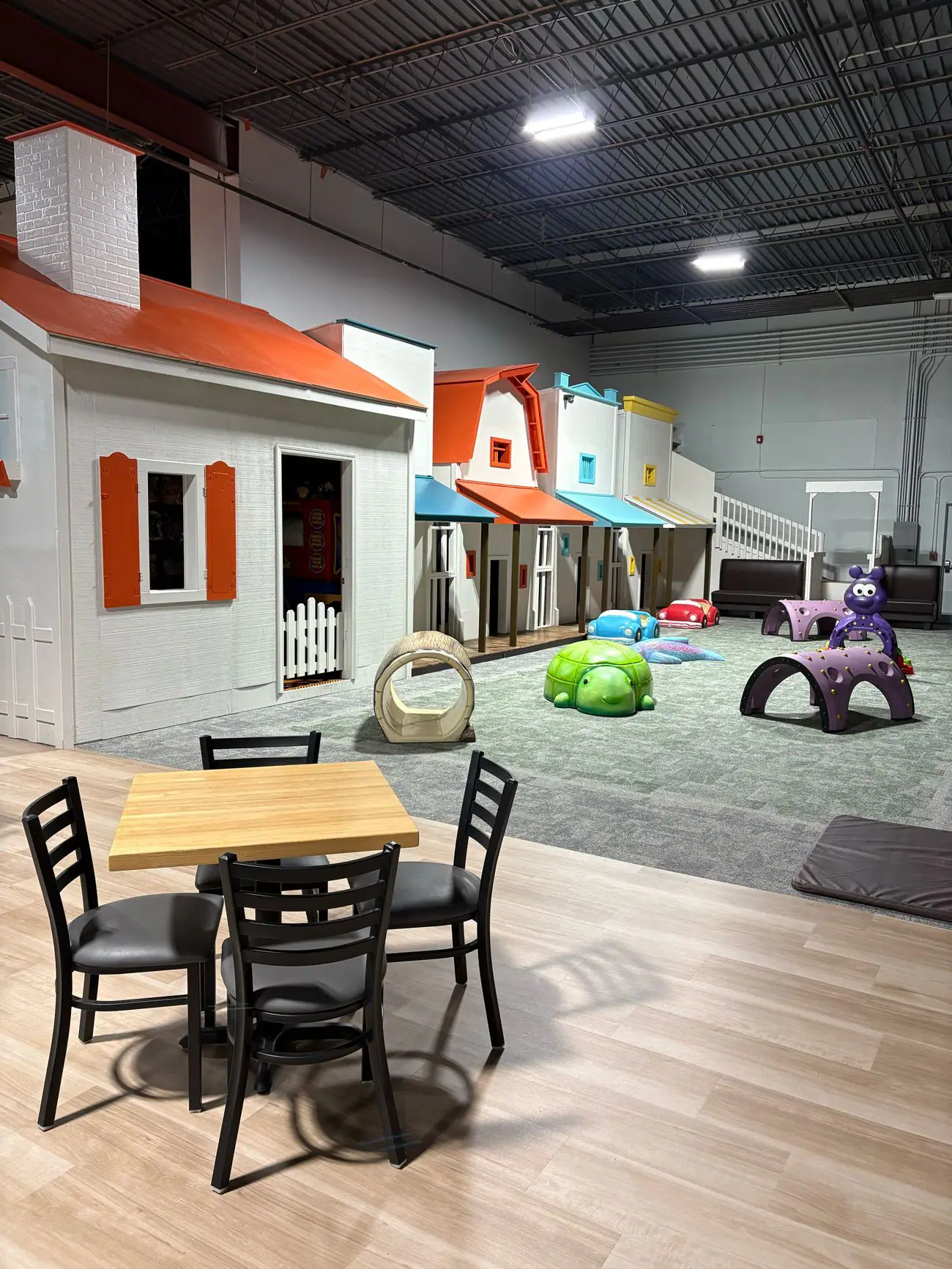 Wooden town play area inside Fun Run Liberty