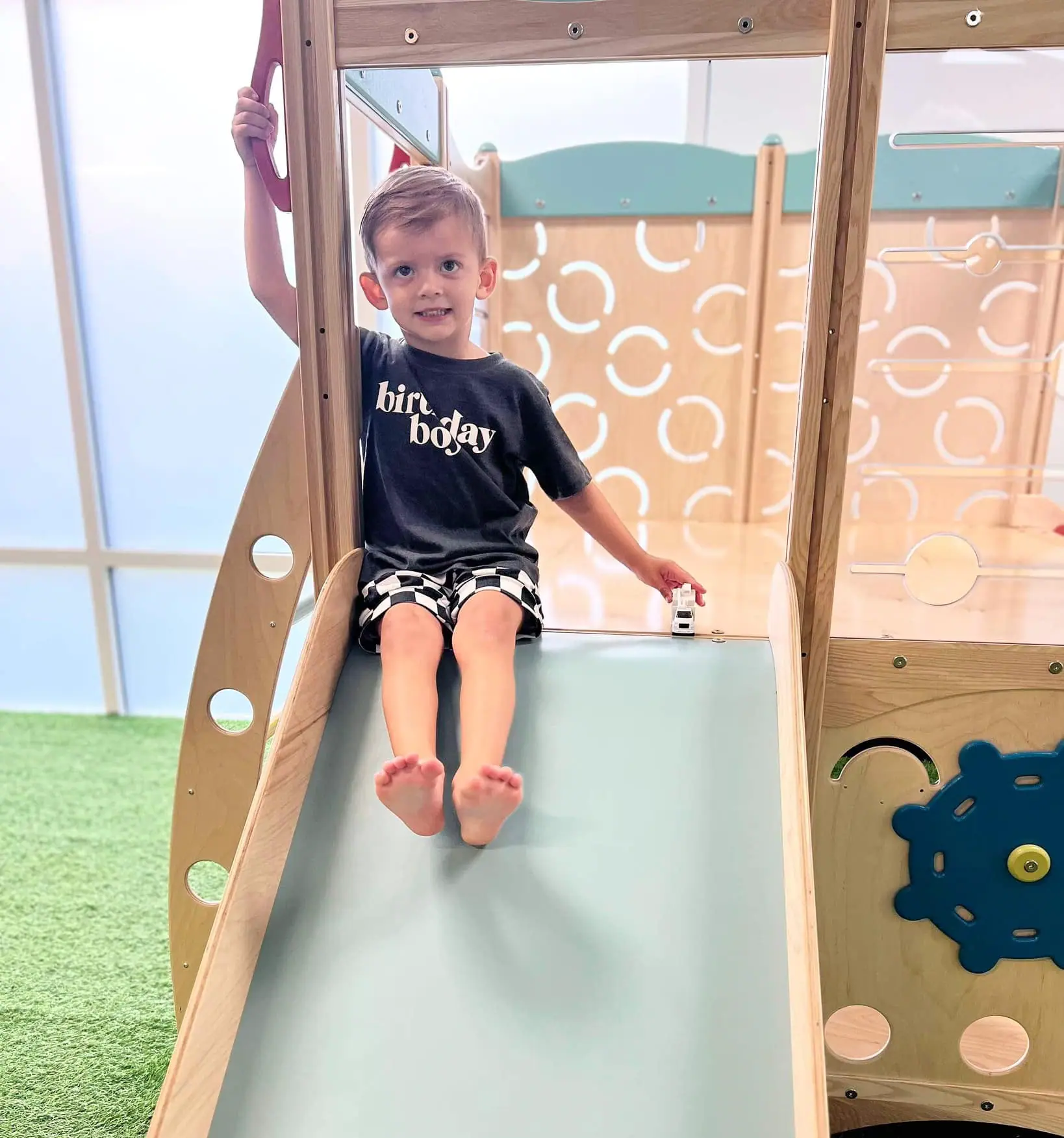 Young child using the indoor play structure at Toddling Around in Chester.