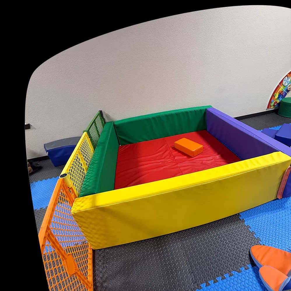 Padded baby-and-toddler play area at Adventure Zone Mineola.