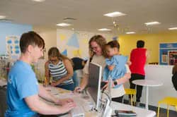 Caregivers at the front counter and café area at To The Stars Play Cafe.