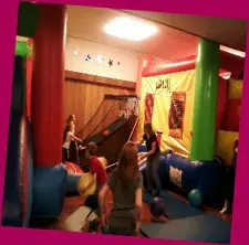 Children playing inside Jump N Jax's colorful indoor bounce and activity space in Klamath Falls.