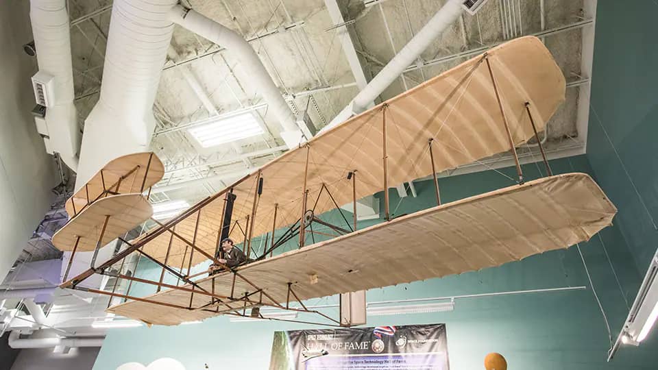 Historic aircraft exhibit suspended inside Thronateeska Heritage Center.