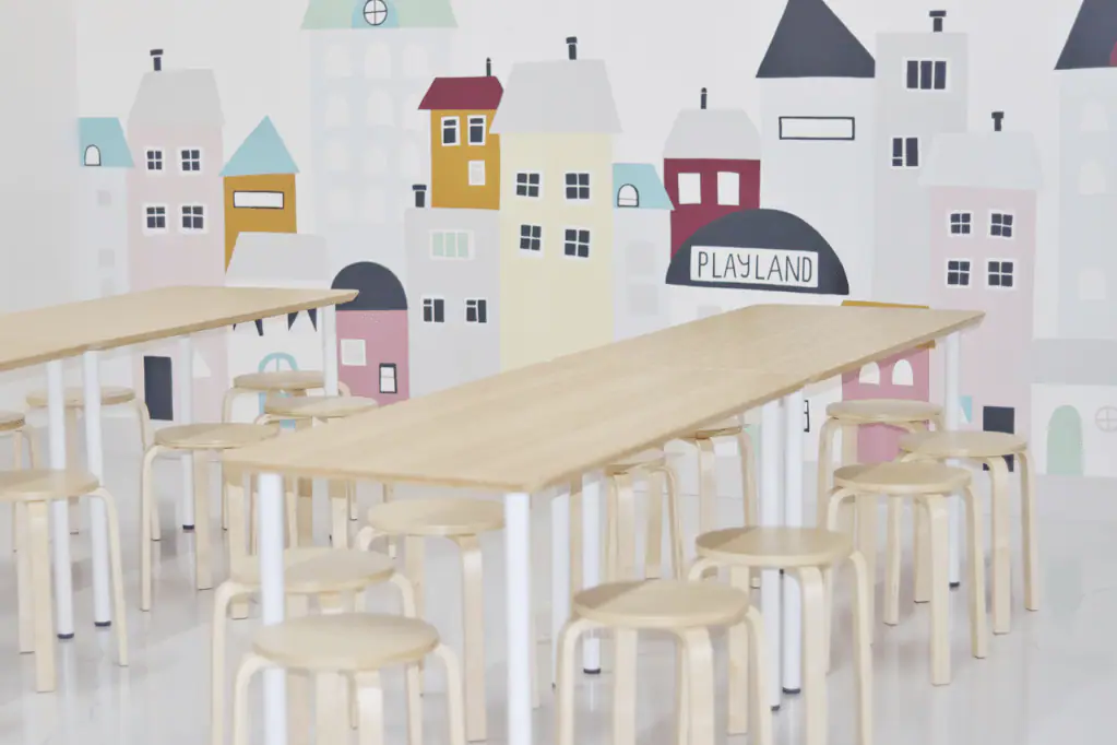 Cafe seating and mural area inside Playland Monroe