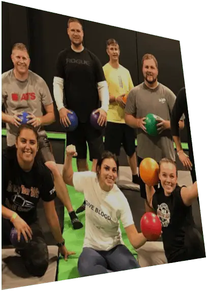 Jumpers playing a ball game inside Elevate Trampoline Park.