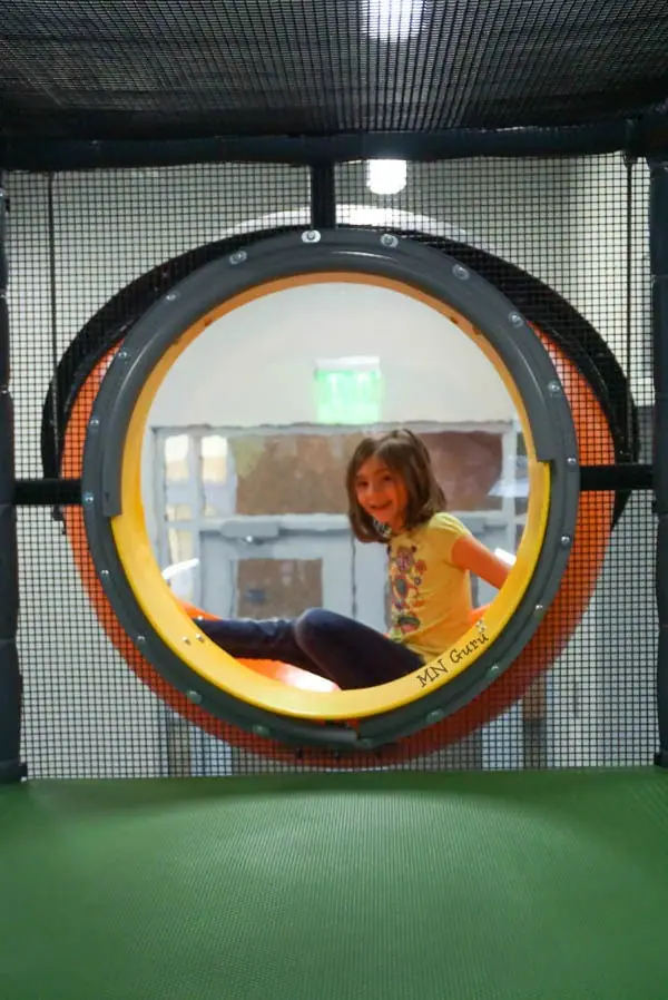 Interior tunnel window inside the KidZone play structure.
