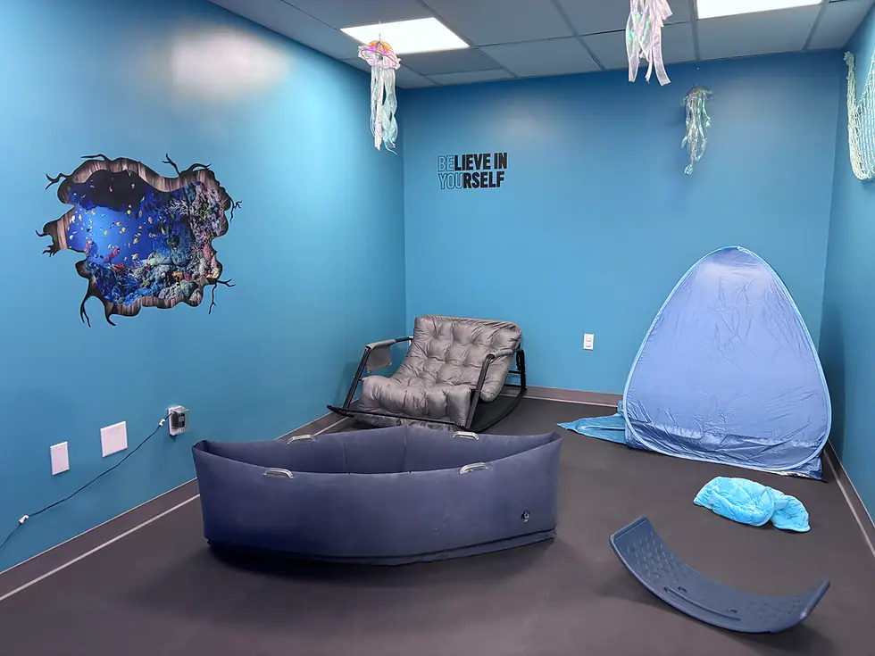 Blue sensory room with calming equipment at Play Palace.