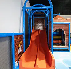 Slide and active play area at Playdate LLC.