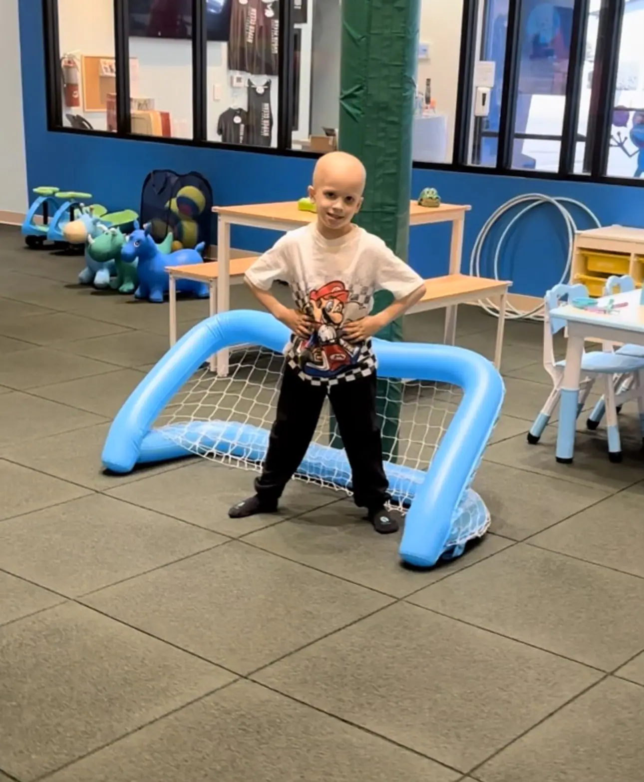 Child using play activity at Lily's Pad
