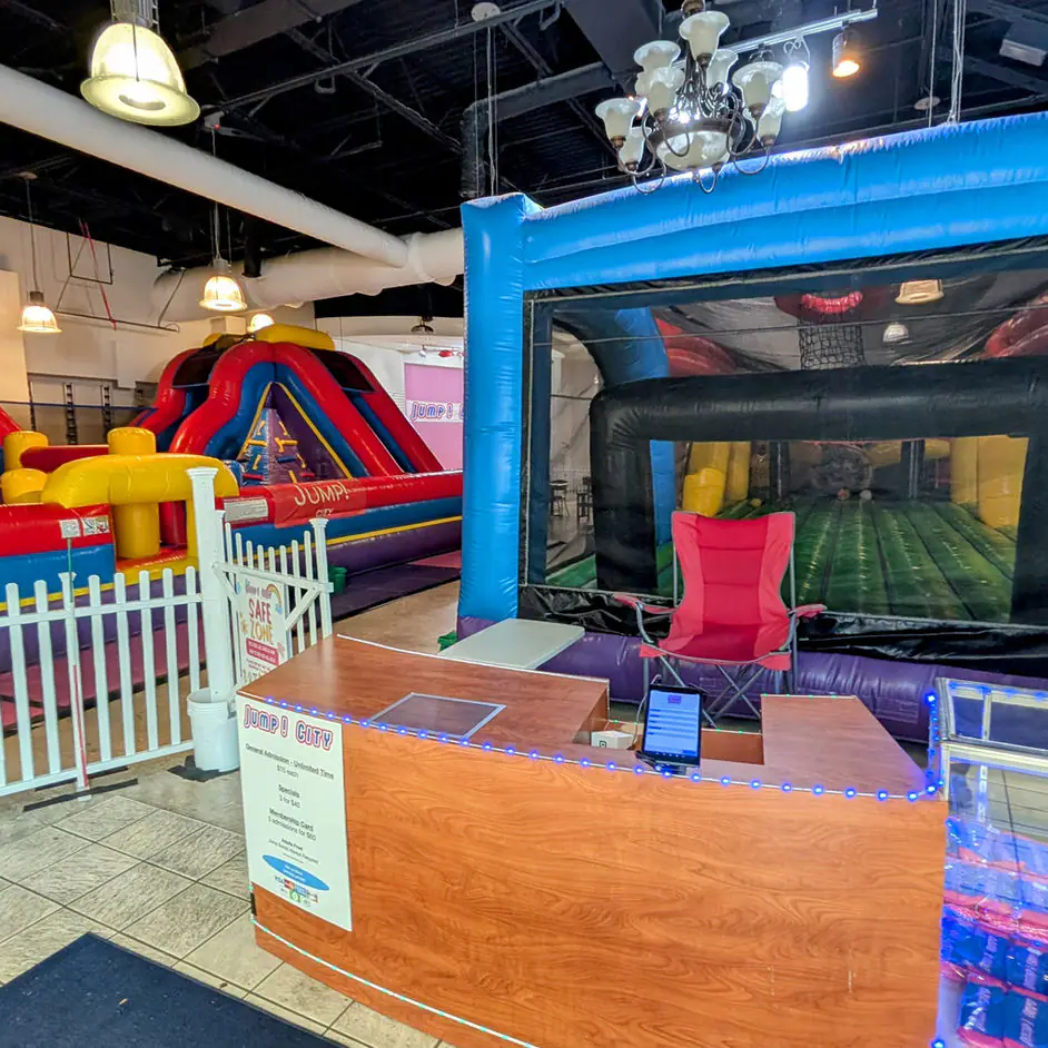 Children moving through the inflatable play space at Jump! City Tracy.
