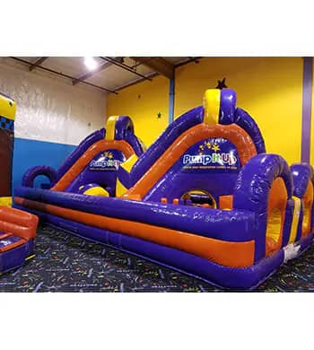Inflatable play attraction inside Pump It Up Trussville.