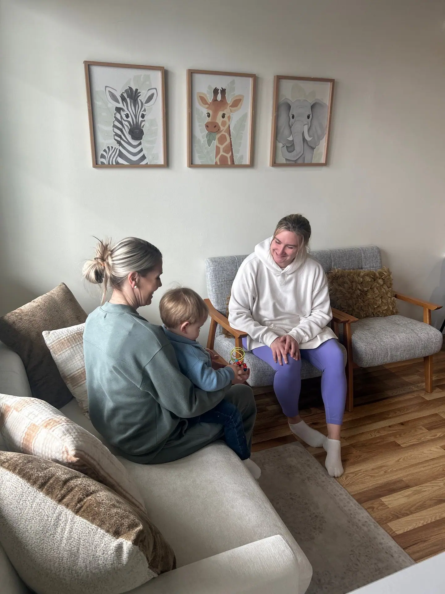 Boutique play area with seating for caregivers at Little Lions Den