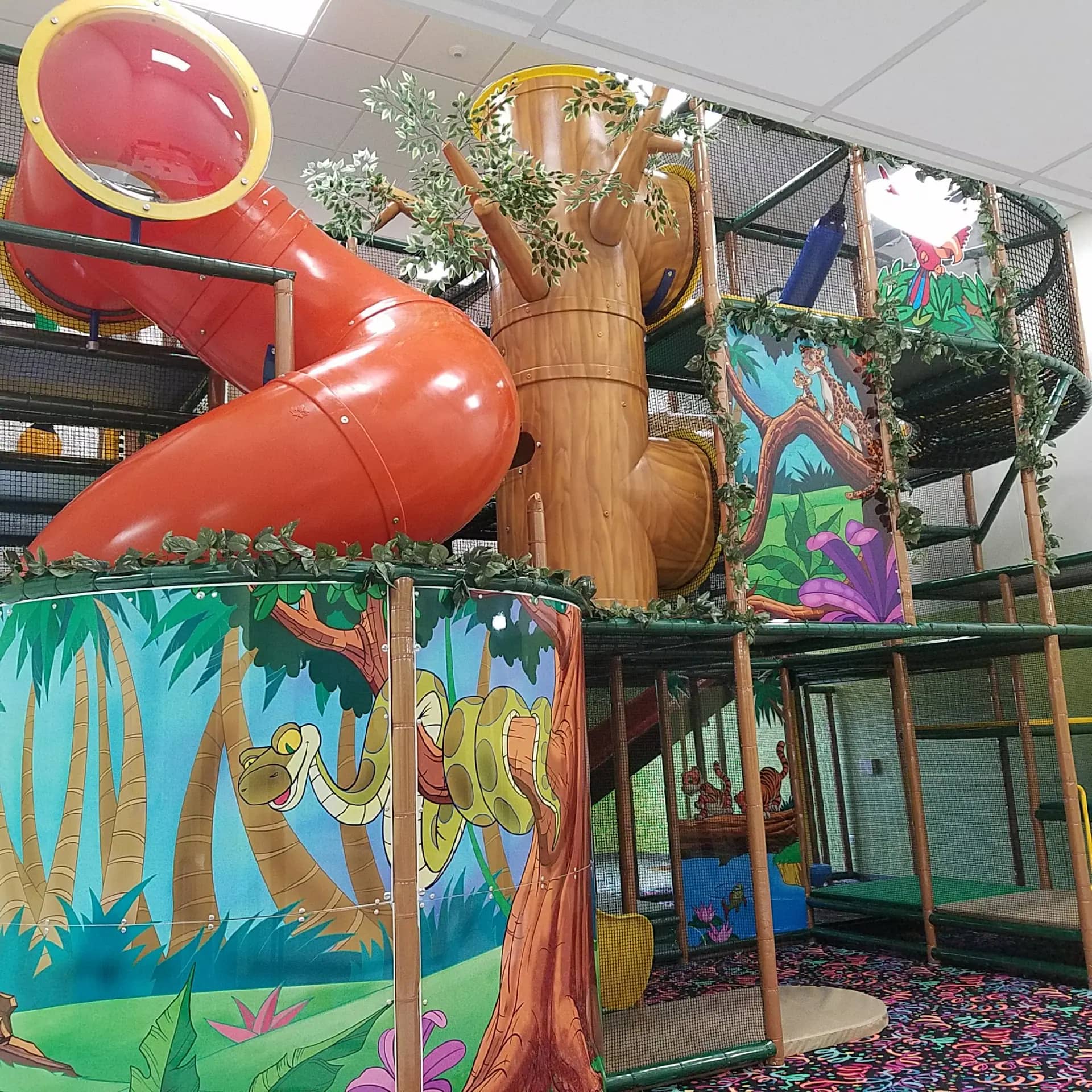 Slides and elevated play features inside Jungle Fun at LoVerde Sports & Rec Center.