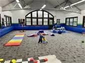 A wider view of Owatonna Indoor Play Space inside the West Hills activity room.