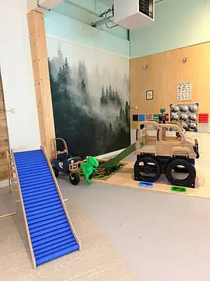 Pretend-play and climbing area at Bananas Kiddo Kingdom.