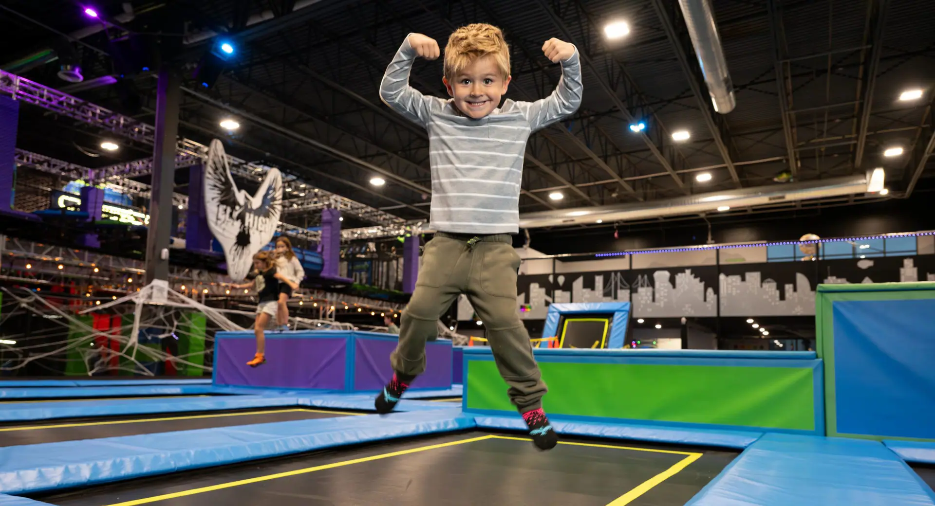 Child jumping inside Fly High Adventure Park Woods Cross