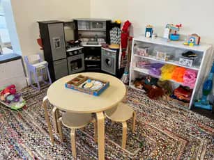 Pretend play table setup inside Itsy Bitsy Play Cafe.