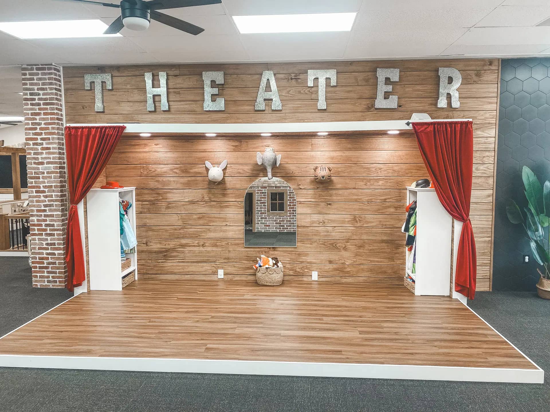 Pretend-play stage area at Simply Play Vero Beach