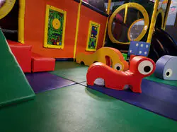 Soft toddler-friendly floor play area inside Cactus Jack's Playhouse.