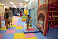 Children exploring the indoor play floor at High 5 Indoor Playground.