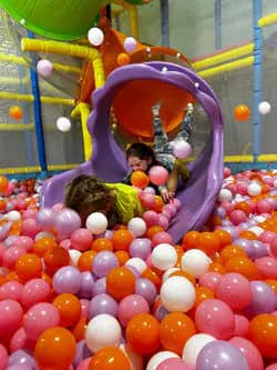 Curved slide and ball-pit section inside Little Sharks Playground.