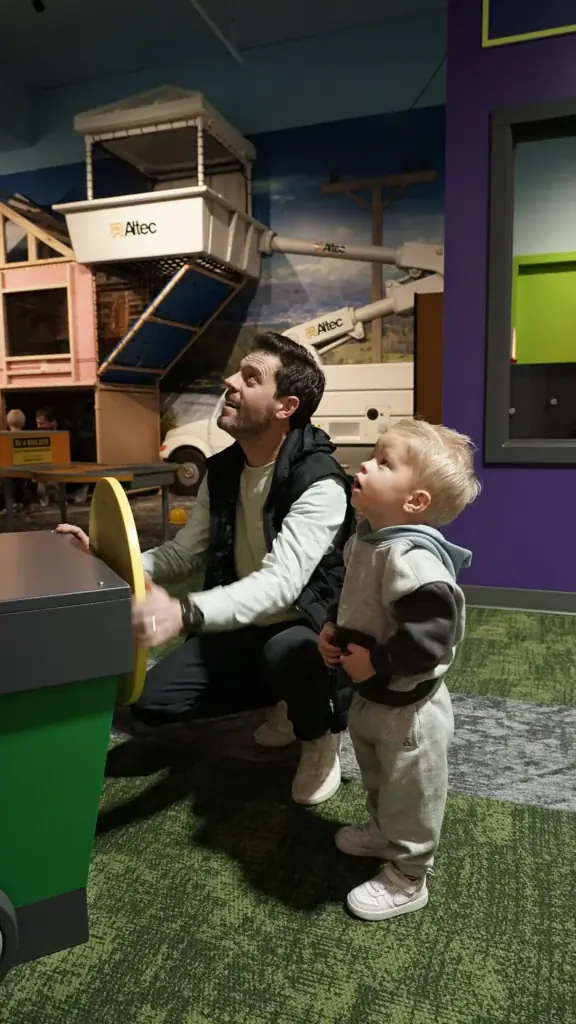 Child and caregiver exploring an exhibit at inspireU Children's Discovery Center