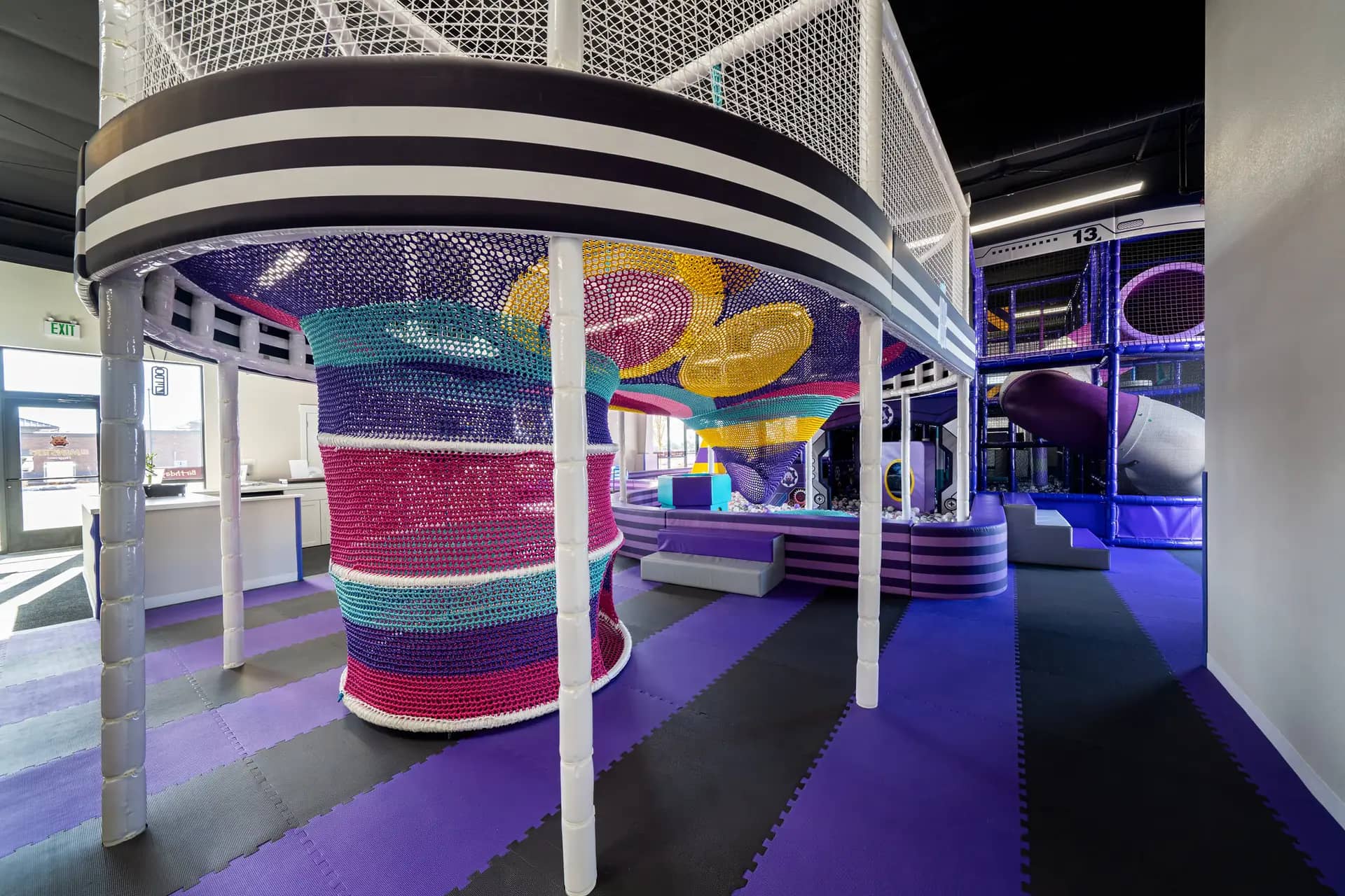 Rope-play area and soft flooring inside Lil Monsters Playground.